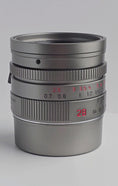 Load and play video in Gallery viewer, Leica 28mm Summicron-M f/2 ASPH Titanium Lens (Used) Limited Edition (Only 333 Worldwide)
